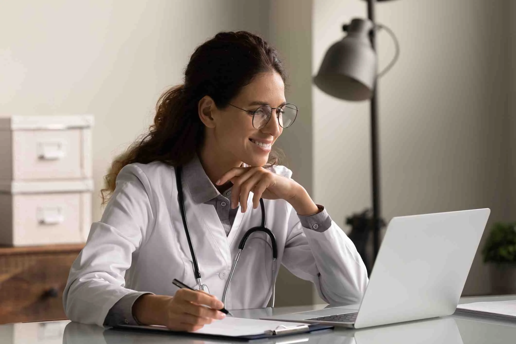 women sitting looking at analytics